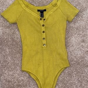 Green button up shirt.